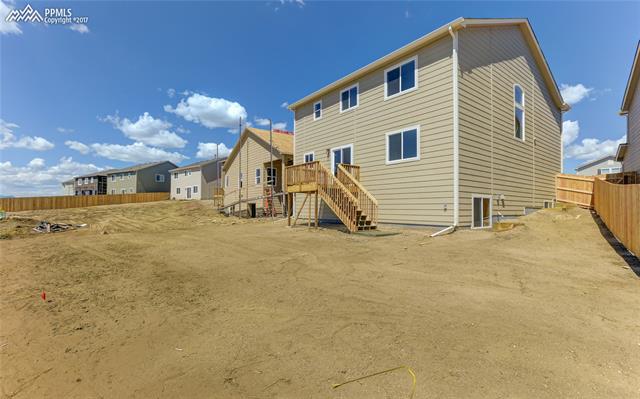 11293 Avena Road Peyton, CO 80831 - Photo 31 of 34 Large backyard that includes full landscaping and backs to private property for extra privacy