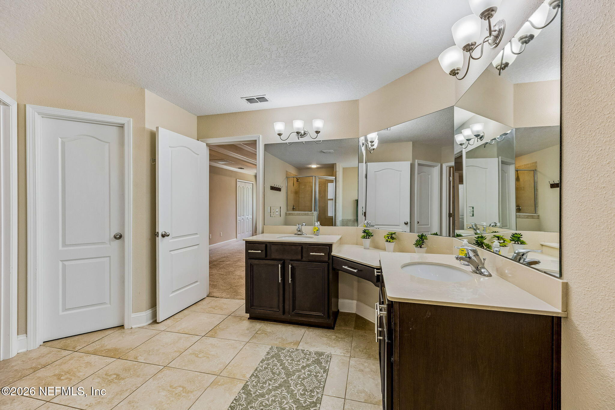 12198 Ridge Crossing Way Jacksonville, FL 32226 - Photo 29 of 67 a spacious bathroom with a double vanity sink mirror and