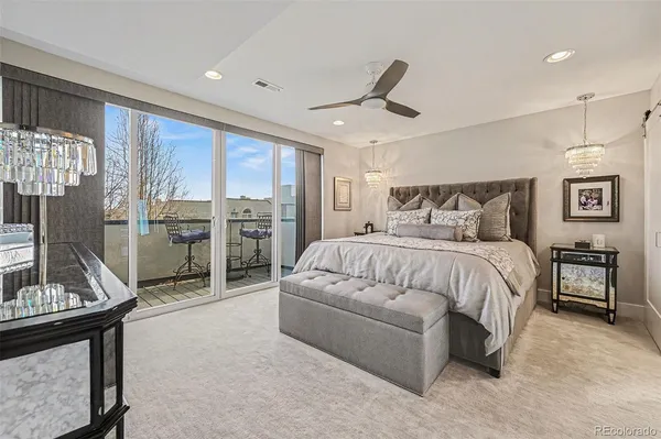 a spacious bedroom with a large bed and a window