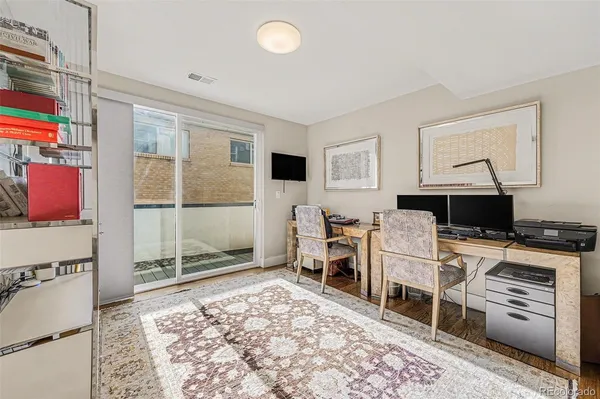 a bed room with a bed and a television