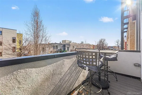 a view of a balcony with furniture