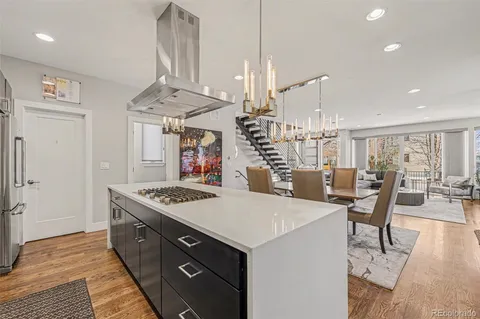 a large kitchen with a table and chairs