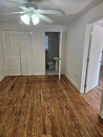 a view of a livingroom with wooden floor