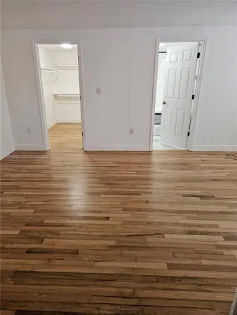 a view of room and wooden floor