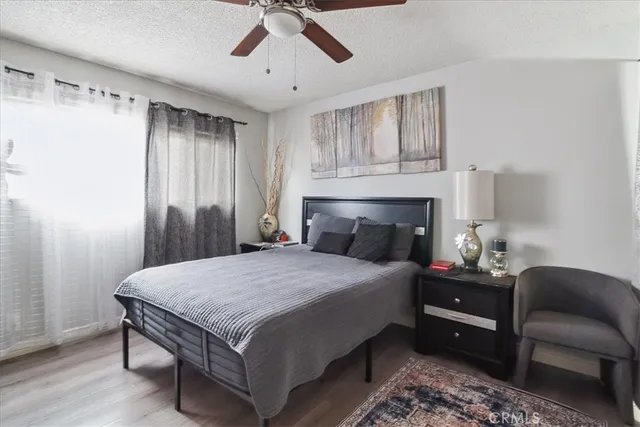 a kitchen with a stove a refrigerator and a table