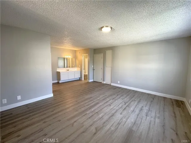 a view of a hardwood floor in a room