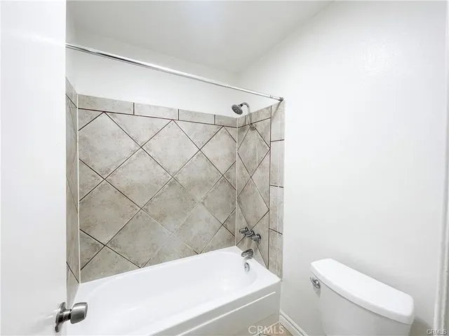 an empty room with large windows