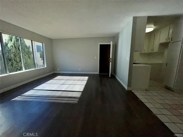a kitchen with a sink cabinets and a window