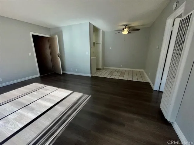a kitchen with a sink a stove and cabinets