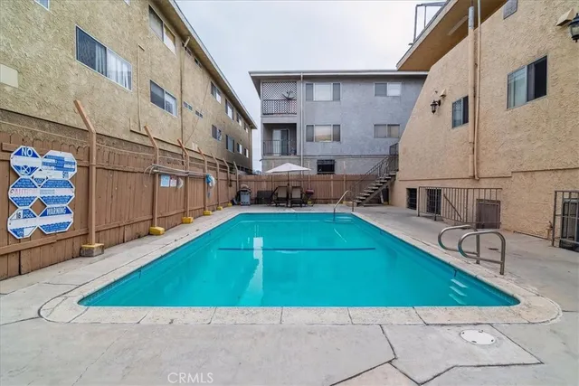 an outdoor space with pool and furniture