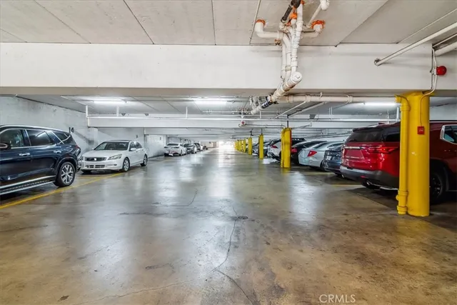 a view of parking garage with cars
