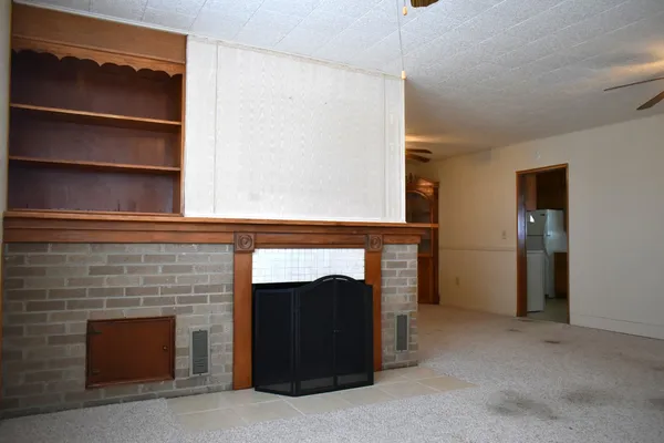 a room with closet and a fireplace