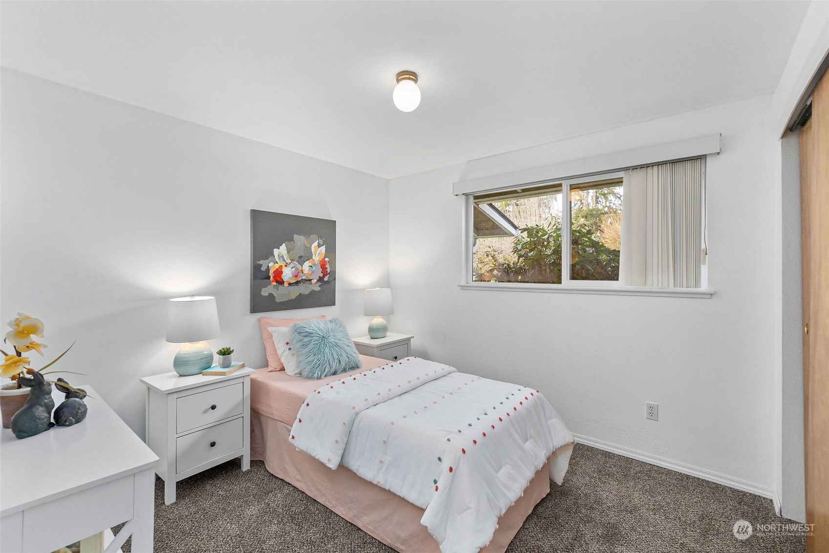 13915 99th Avenue Southeast Snohomish, WA 98296 - Photo 12 of 30 a bedroom with a bed and a dresser next to a window