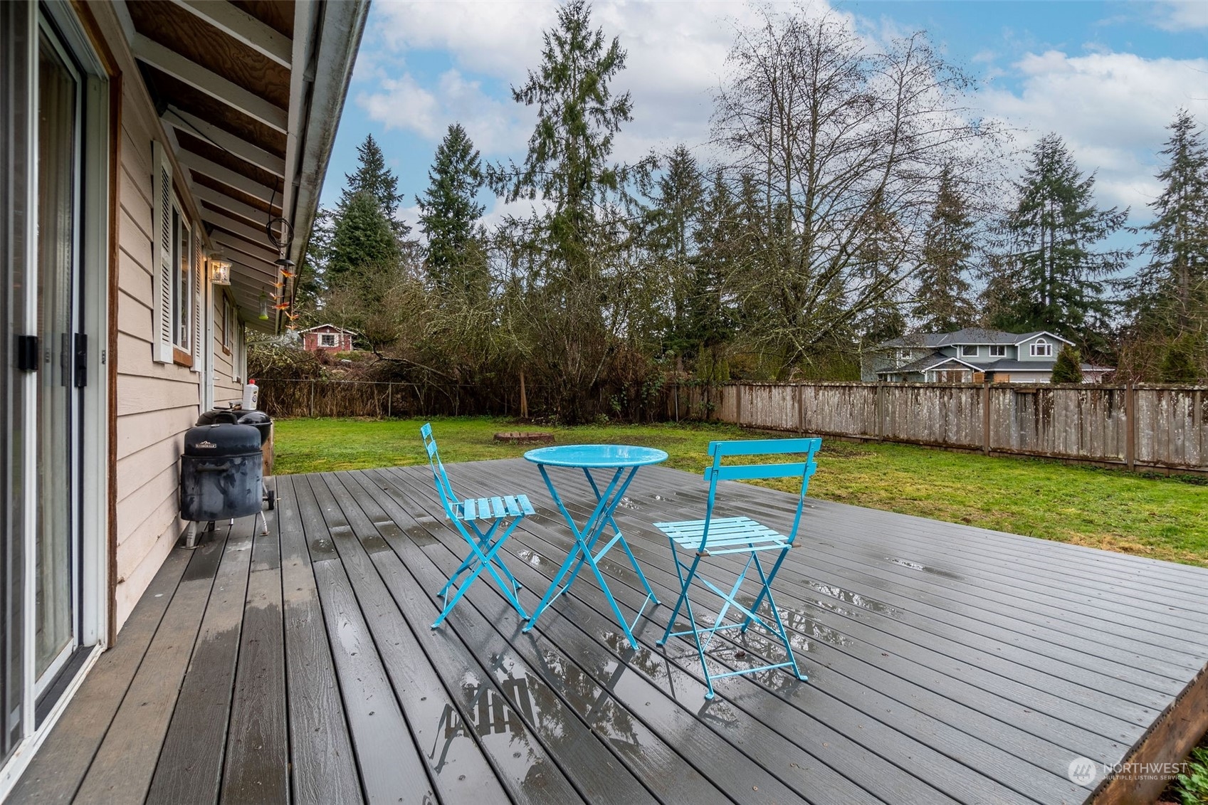 13915 99th Avenue Southeast Snohomish, WA 98296 - Photo 18 of 30 a view of a chairs and table on the wooden deck