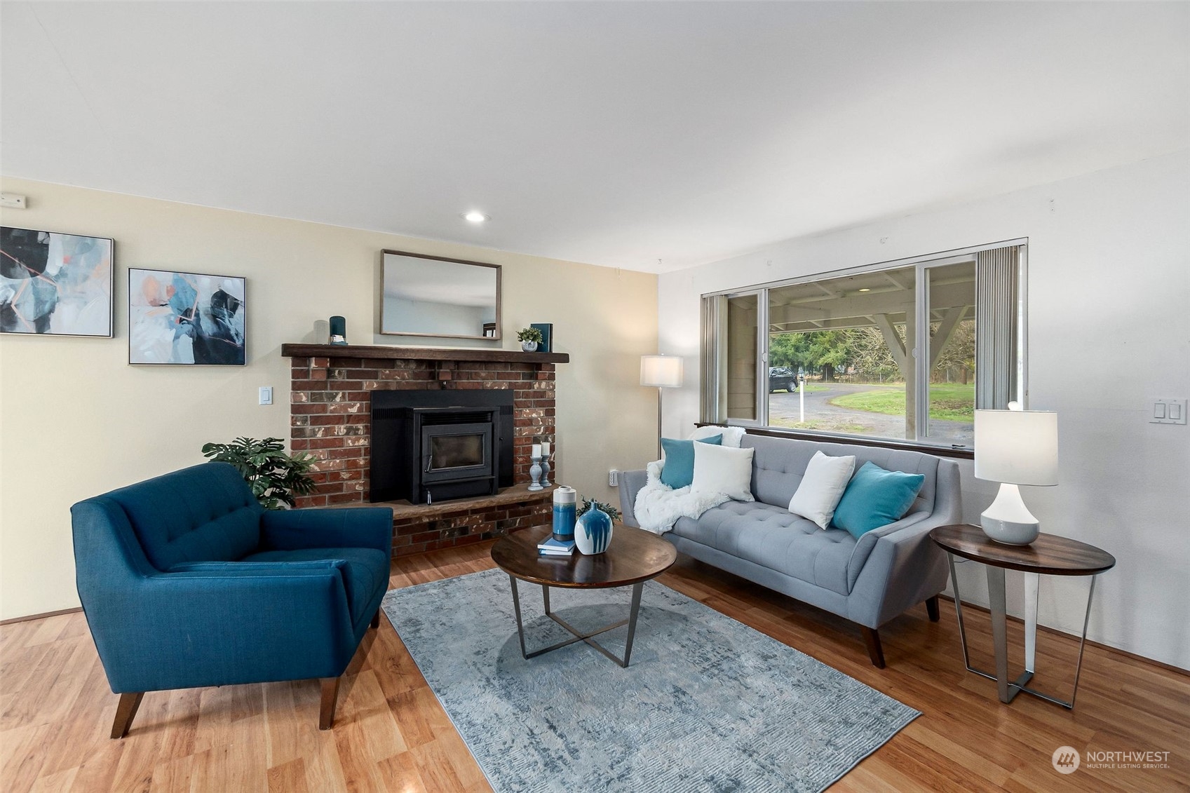 13915 99th Avenue Southeast Snohomish, WA 98296 - Photo 2 of 30 a living room with furniture and a fireplace