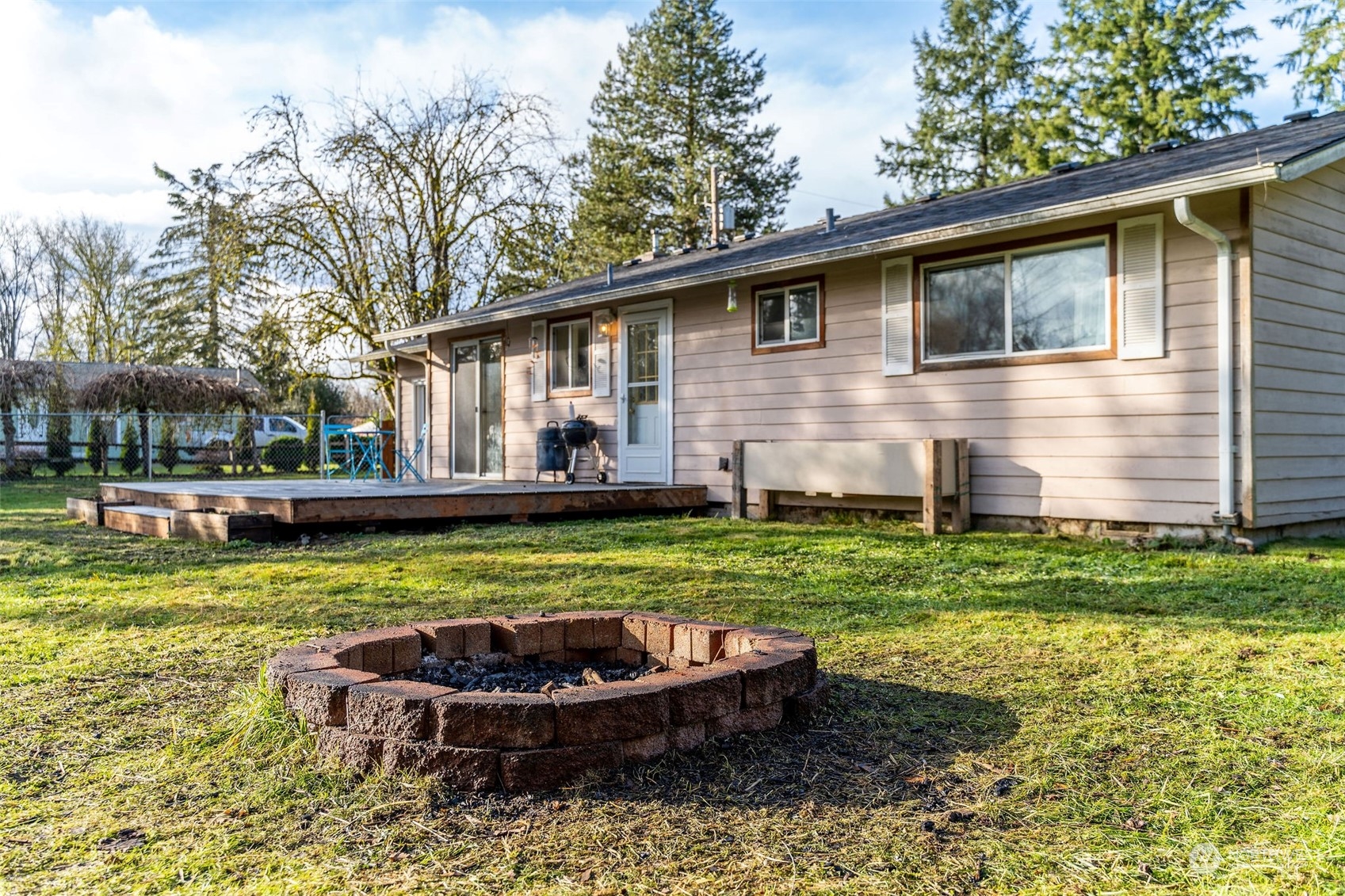 13915 99th Avenue Southeast Snohomish, WA 98296 - Photo 21 of 30 a front view of house with yard and outdoor seating