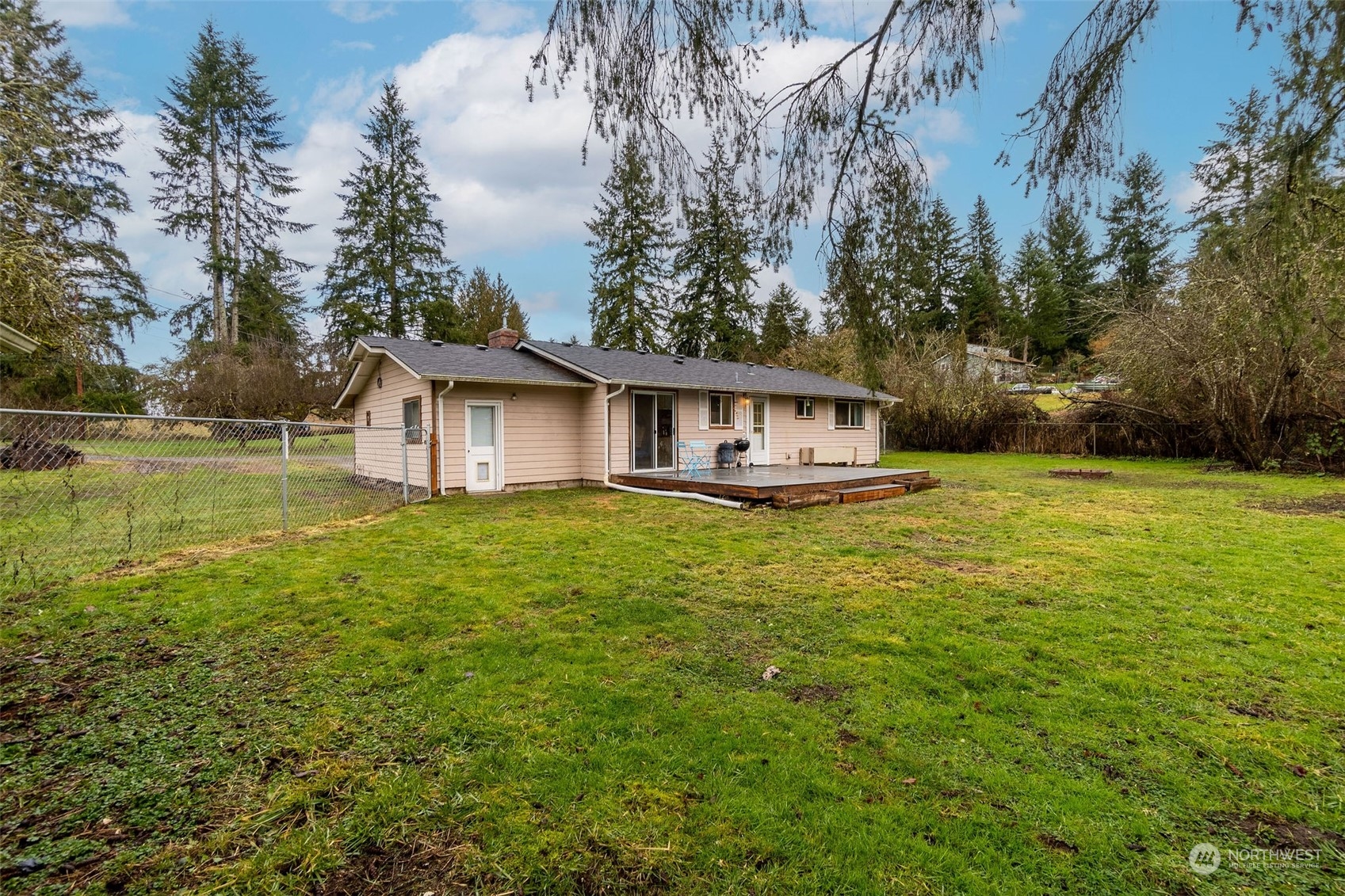 13915 99th Avenue Southeast Snohomish, WA 98296 - Photo 22 of 30 a view of a house with a yard and sitting area