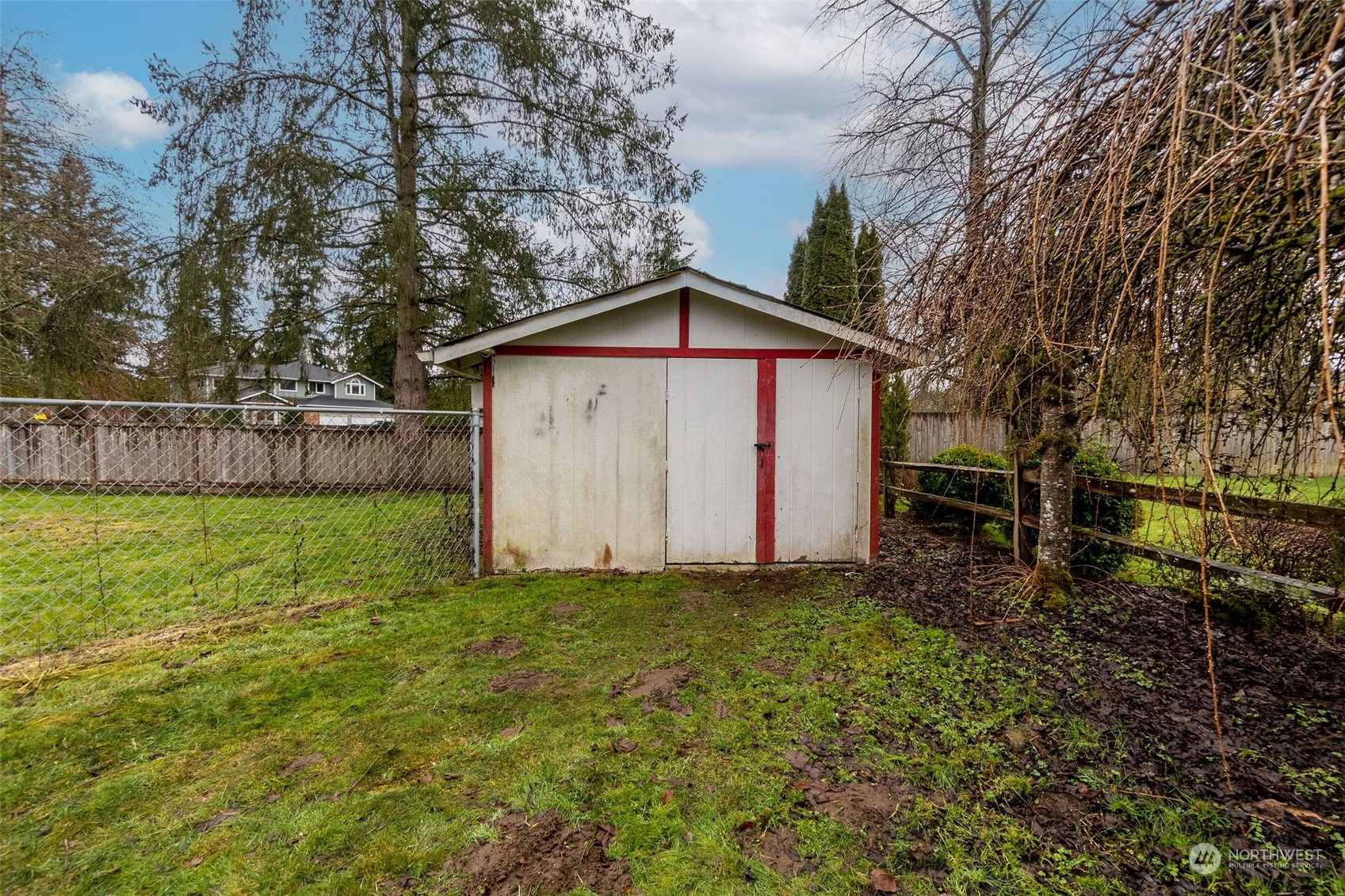 13915 99th Avenue Southeast Snohomish, WA 98296 - Photo 23 of 30 a view of backyard with large trees and wooden fence