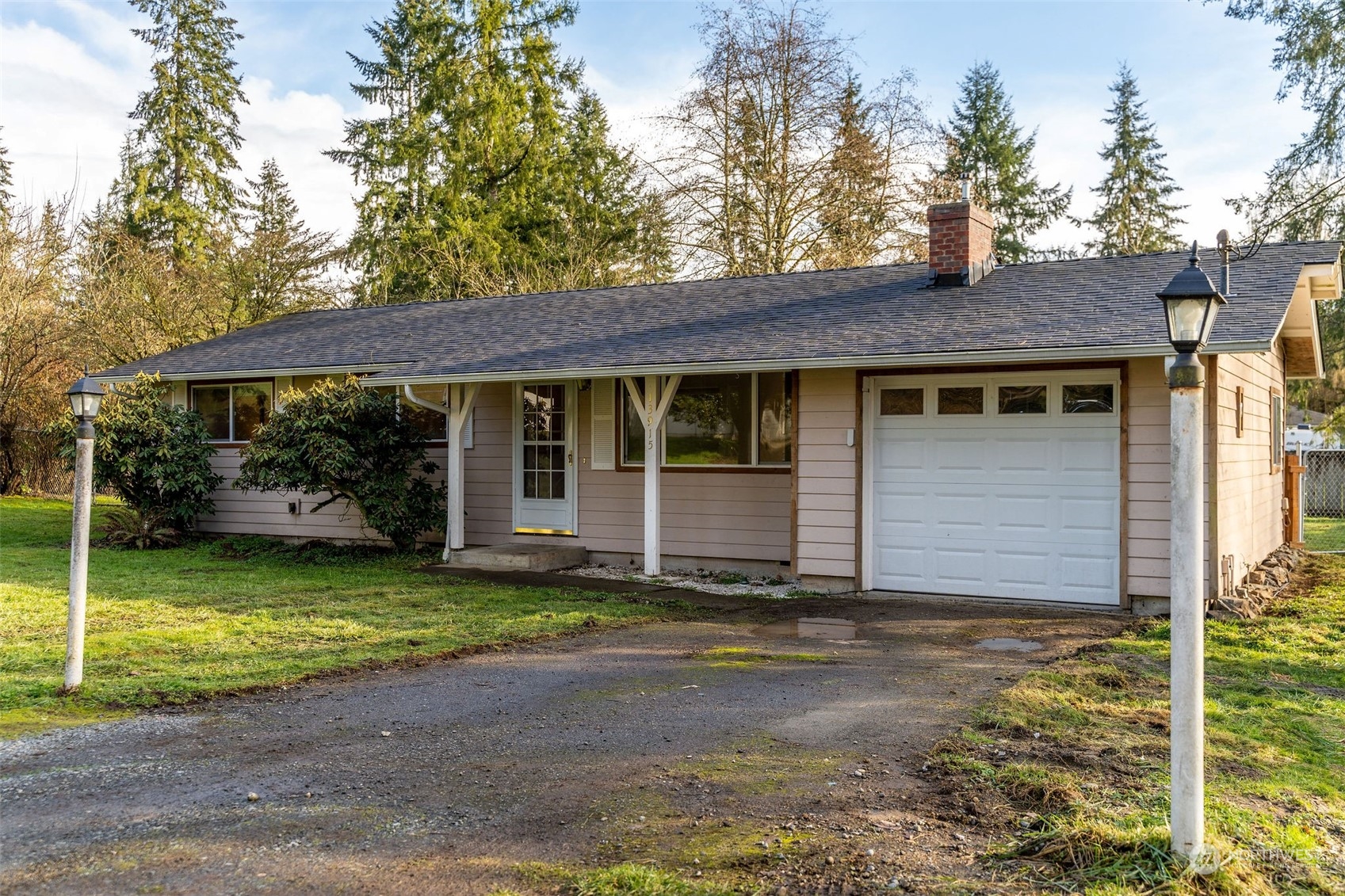 13915 99th Avenue Southeast Snohomish, WA 98296 - Photo 25 of 30 a front view of a house with a yard