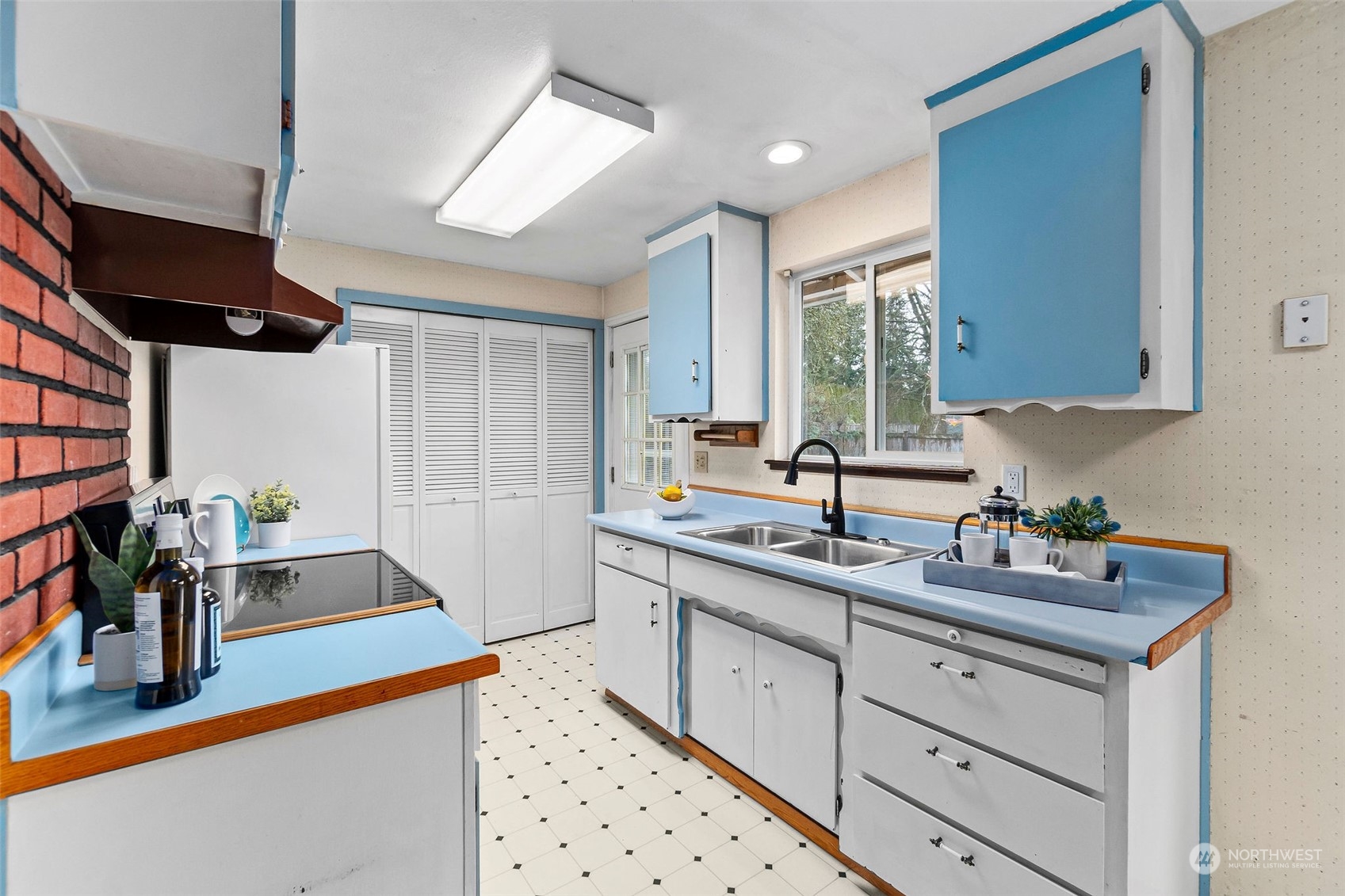13915 99th Avenue Southeast Snohomish, WA 98296 - Photo 6 of 30 a kitchen with sink cabinets and window