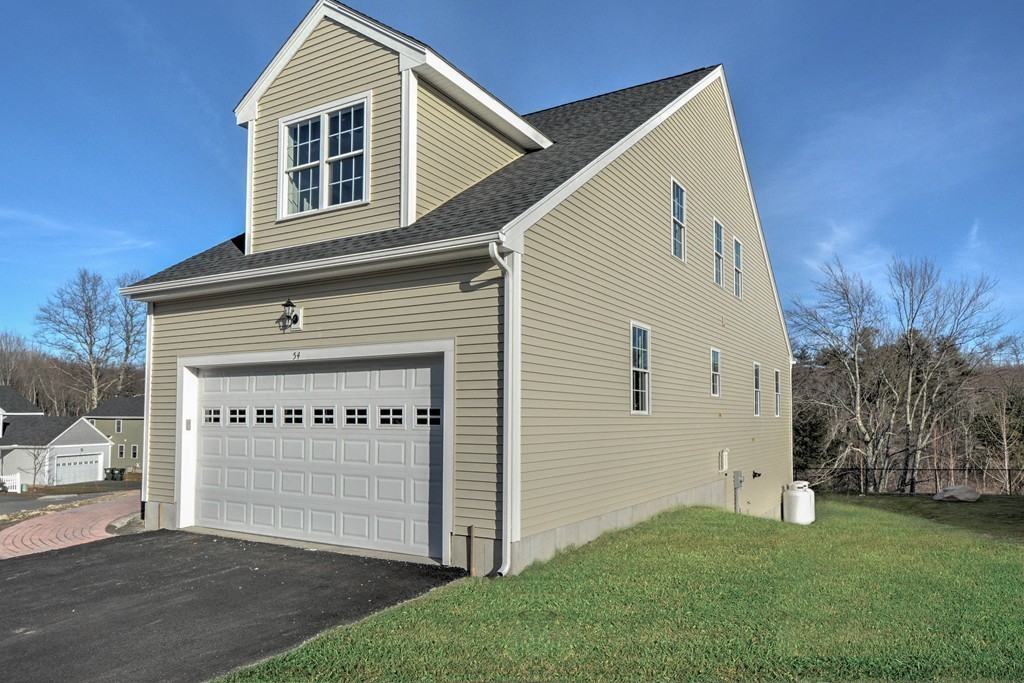 54 Partridge Hill Road Sutton, MA 01590 - Photo 19 of 20 a front view of a house with a garden