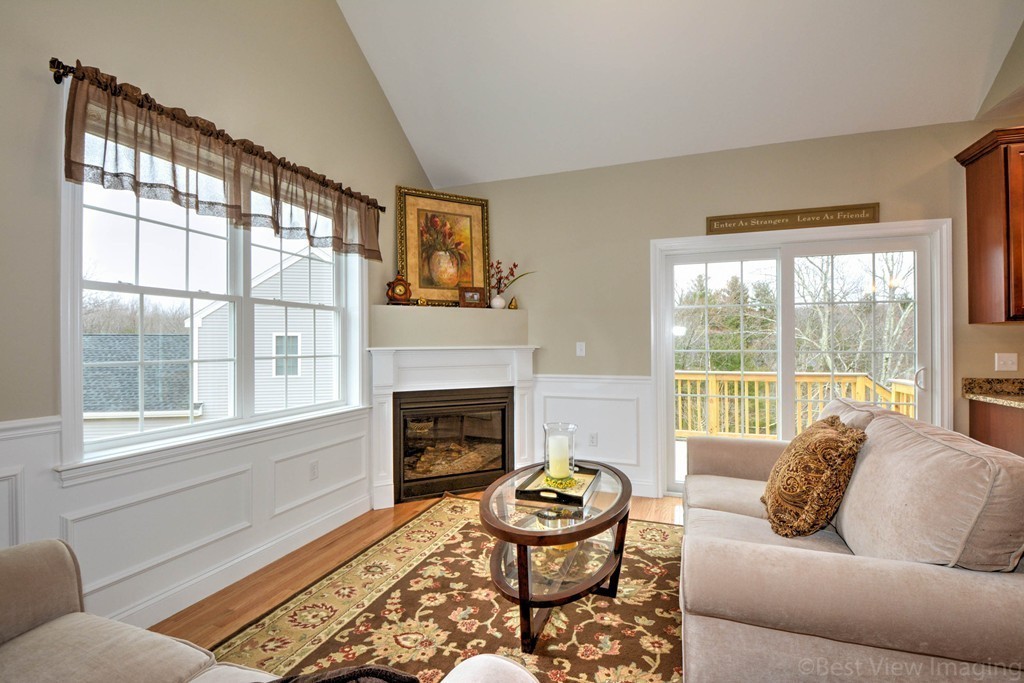 54 Partridge Hill Road Sutton, MA 01590 - Photo 9 of 20 a living room with furniture and a fireplace