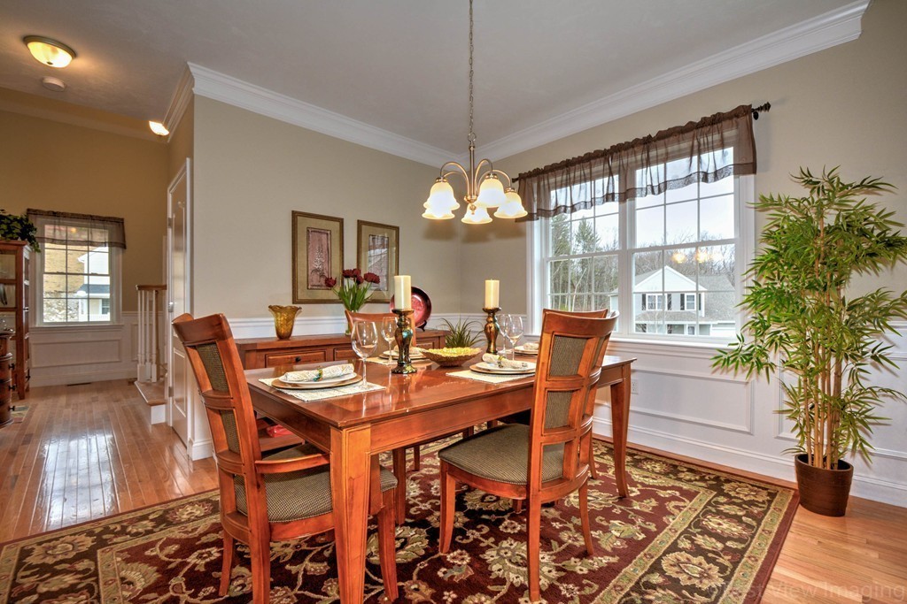 54 Partridge Hill Road Sutton, MA 01590 - Photo 10 of 20 a dining room with furniture a chandelier and wooden floor