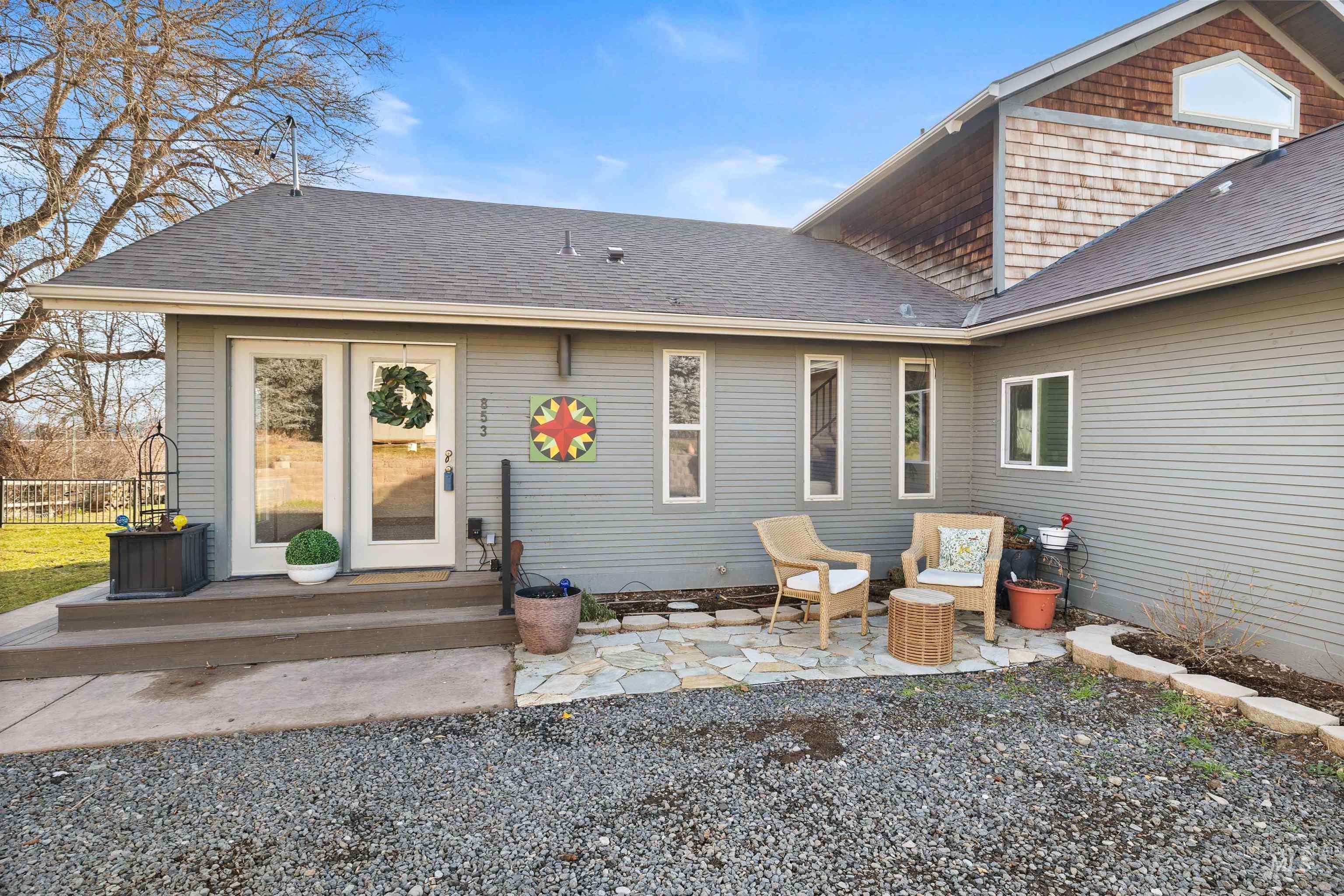 853 Pottery Road Bliss, ID 83314 - Photo 4 of 50 Back of property with a shingled roof, a patio, and a deck