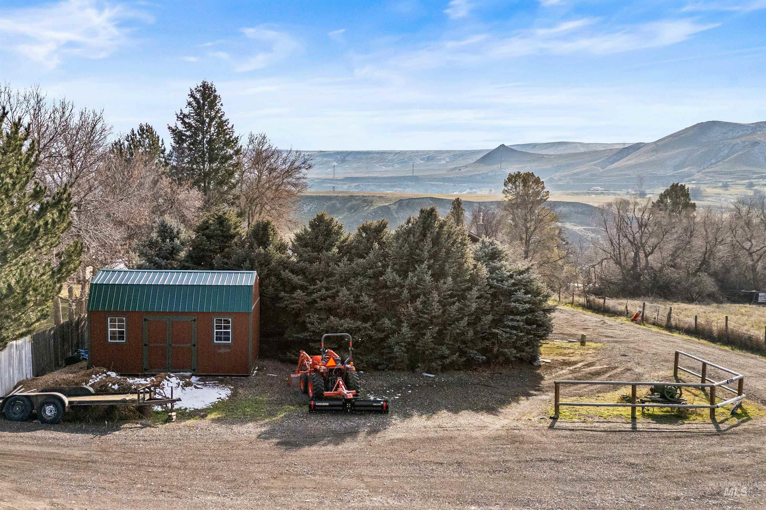 853 Pottery Road Bliss, ID 83314 - Photo 44 of 50 View of yard featuring a shed and a mountain view
