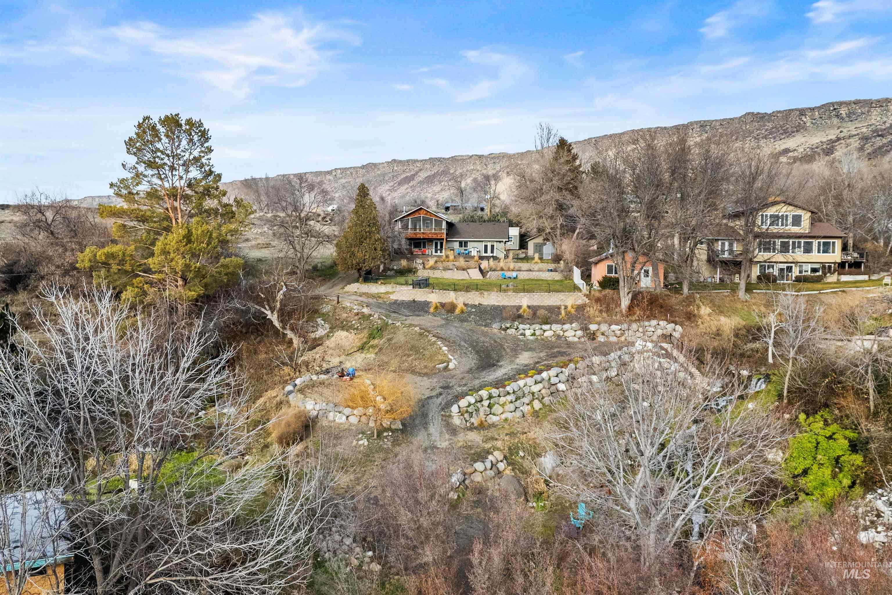 853 Pottery Road Bliss, ID 83314 - Photo 47 of 50 Aerial view of property and surrounding area with a mountain backdrop