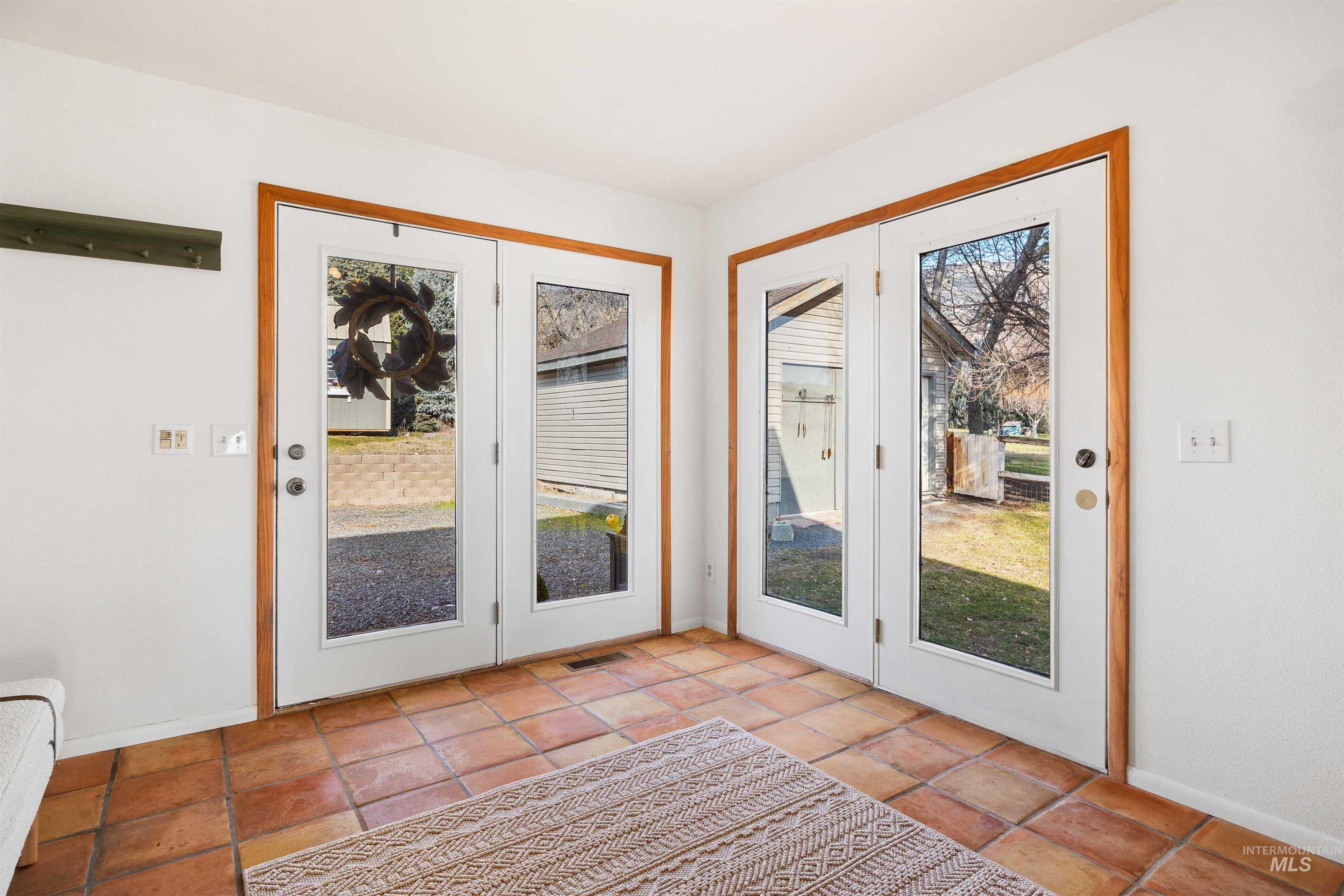 853 Pottery Road Bliss, ID 83314 - Photo 6 of 50 Doorway to outside featuring baseboards