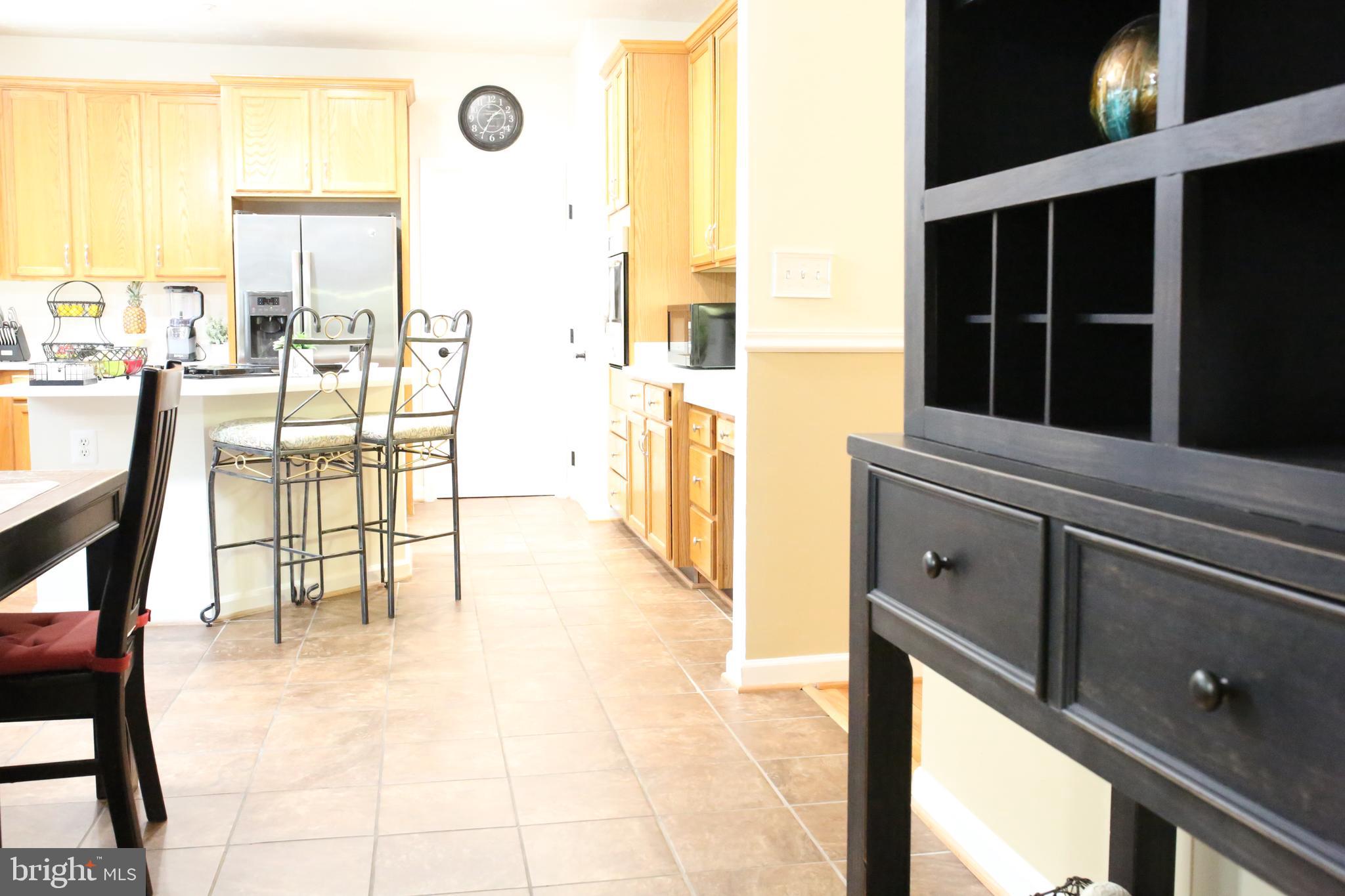 9705 Rider Court Fort Washington, MD 20744 - Photo 34 of 66 Laundry room door under clock