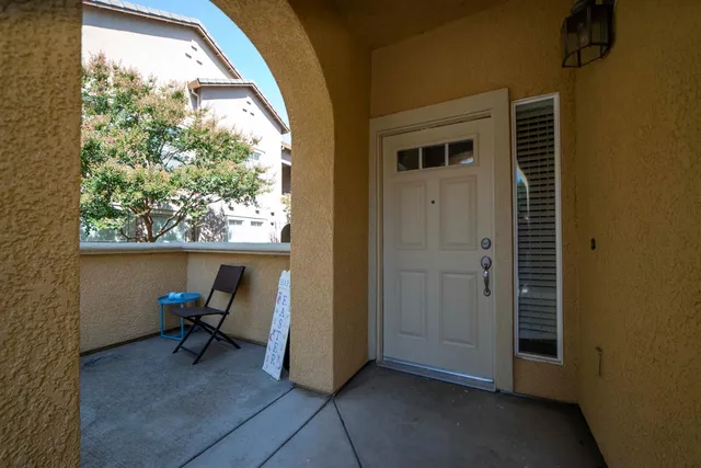 a view of a workspace with a window and sitting area