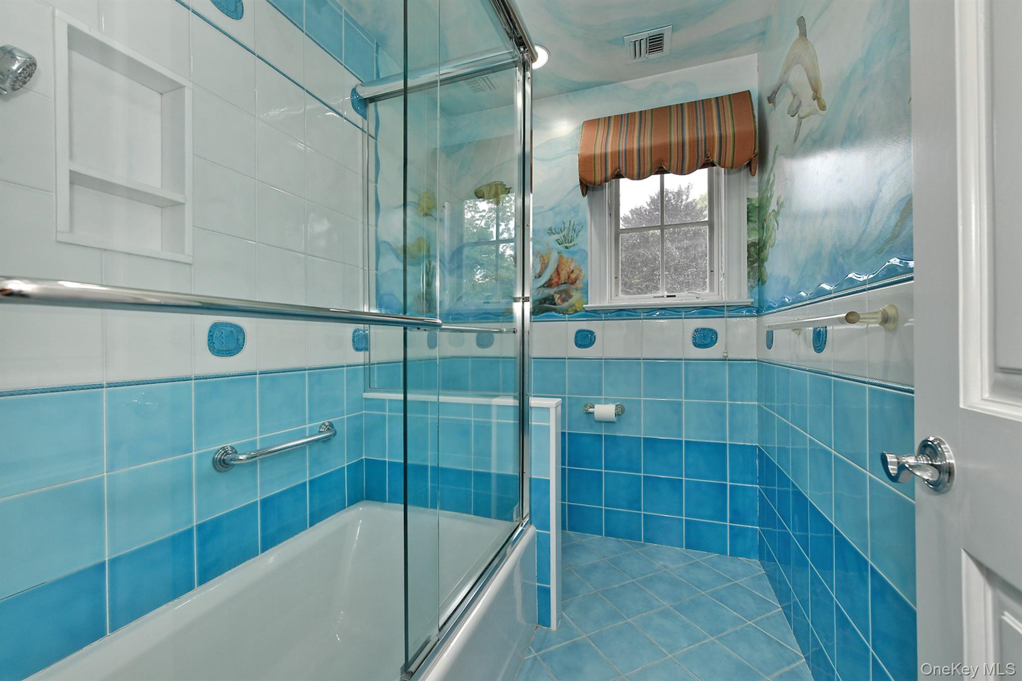 14 Norgate Road Glen Head, NY 11545 - Photo 27 of 44 a bathroom with a glass shower door