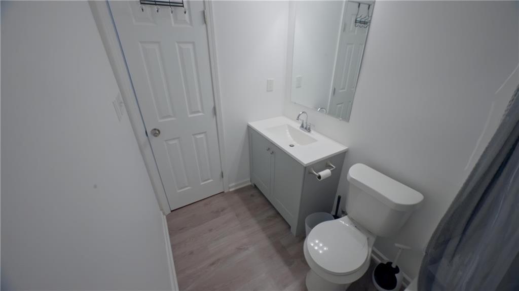 884 Coleman Street Southwest Atlanta, GA 30310 - Photo 23 of 30 a bathroom with a sink toilet and vanity