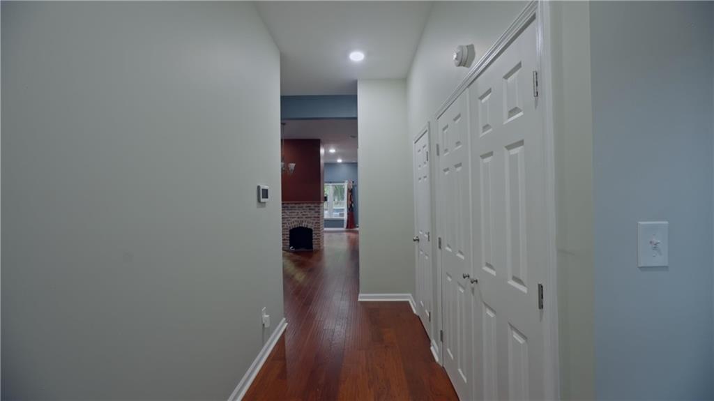 884 Coleman Street Southwest Atlanta, GA 30310 - Photo 8 of 30 a view of a hallway with wooden floor and staircase