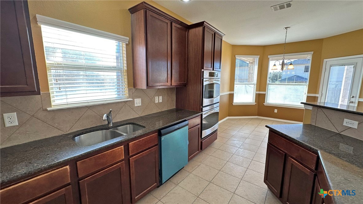 5203 Willamette Lane Killeen, TX 76549 - Photo 16 of 48 a kitchen with a sink and large window