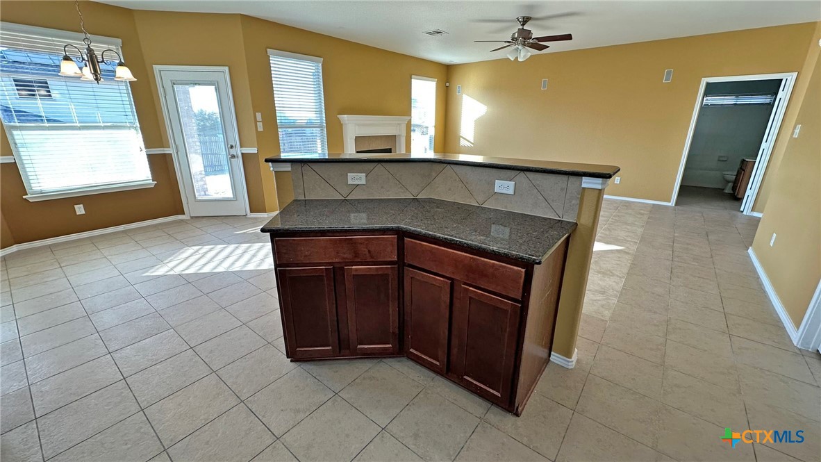 5203 Willamette Lane Killeen, TX 76549 - Photo 19 of 48 a kitchen with a sink and a refrigerator