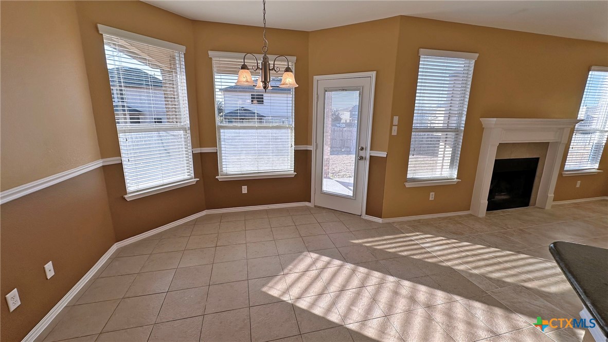 5203 Willamette Lane Killeen, TX 76549 - Photo 21 of 48 a view of an empty room with a fireplace and a window