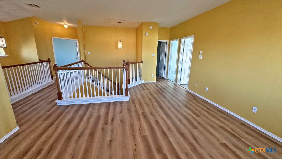 5203 Willamette Lane Killeen, TX 76549 - Photo 32 of 48 a view of a room with wooden floor and stairs