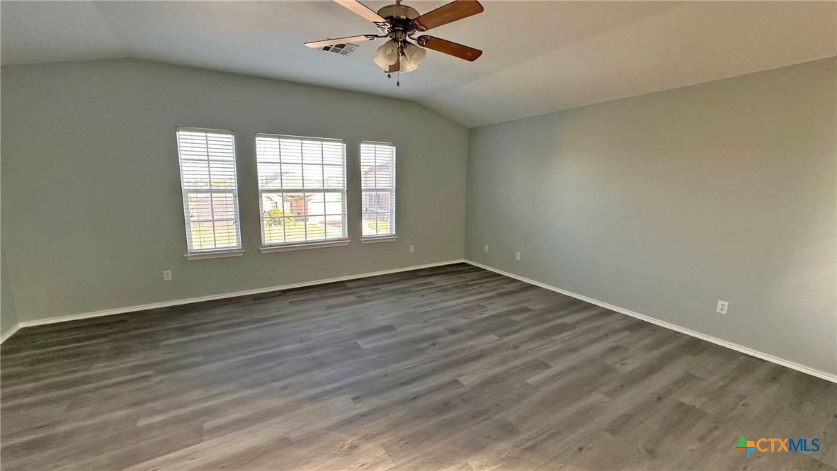 5203 Willamette Lane Killeen, TX 76549 - Photo 38 of 48 wooden floor in an empty room with a window