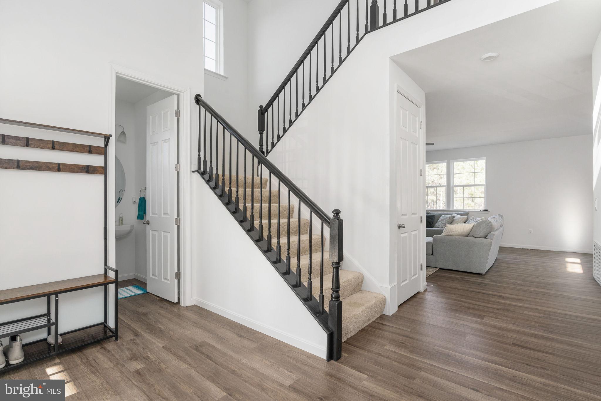 6371 Pointer Lane King George, VA 22485 - Photo 13 of 51 Elegant light-filled split staircase.