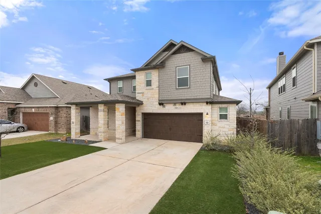 a front view of a house with yard