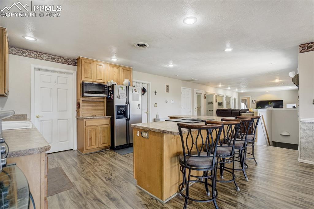 27875 County Farm Road Pueblo, CO 81006 - Photo 12 of 50 a kitchen with a table and chairs in it