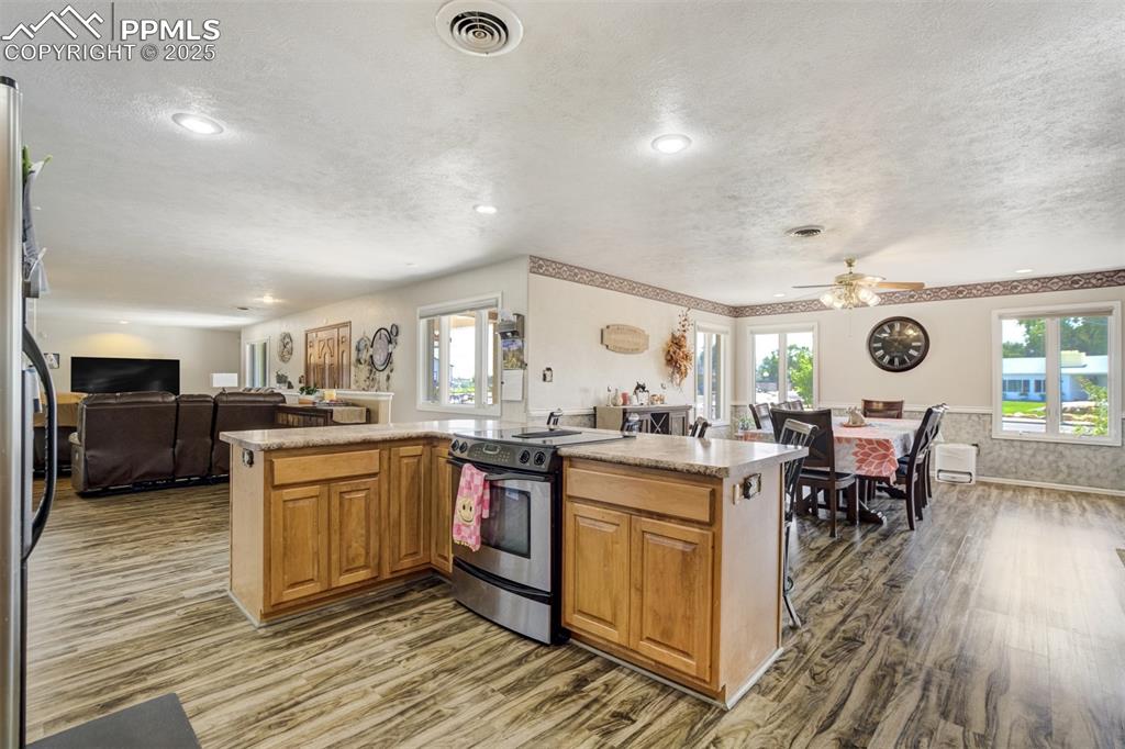 27875 County Farm Road Pueblo, CO 81006 - Photo 13 of 50 a kitchen with stainless steel appliances granite countertop a stove and cabinets