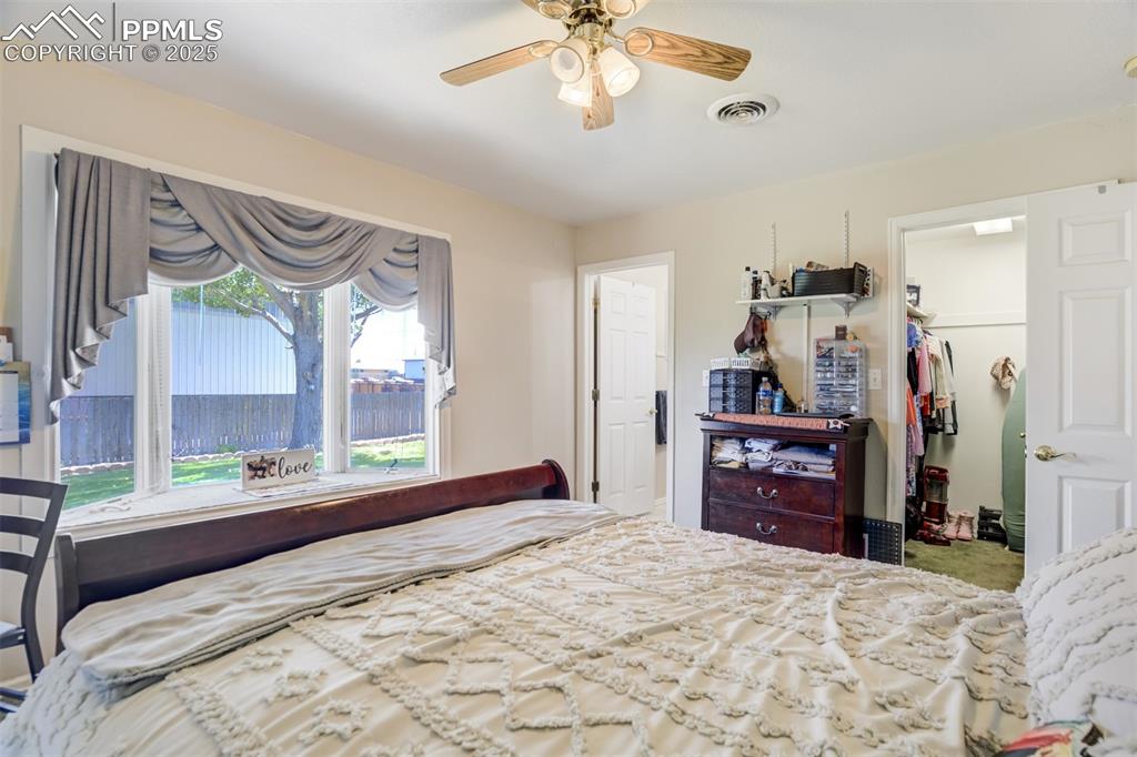 27875 County Farm Road Pueblo, CO 81006 - Photo 22 of 50 a bedroom with a bed dresser and a large mirror