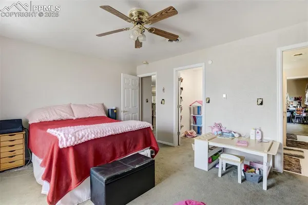 a bed room with a bed and a chandelier