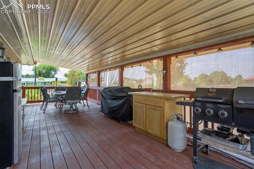 27875 County Farm Road Pueblo, CO 81006 - Photo 37 of 50 a view of a patio with table and chairs and wooden floor