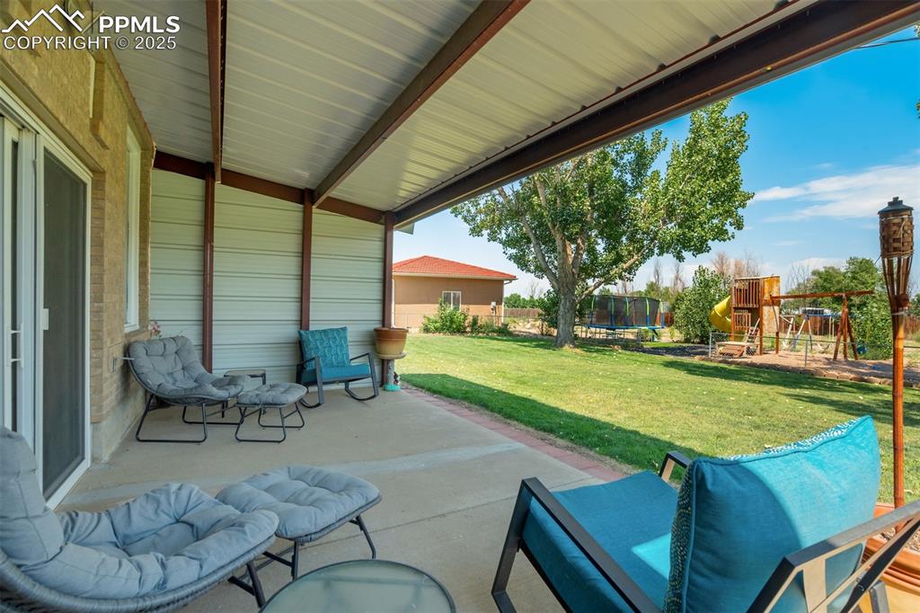 27875 County Farm Road Pueblo, CO 81006 - Photo 39 of 50 a backyard of a house with outdoor seating