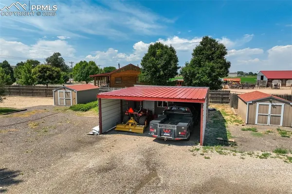 a view of a car park in front of a house